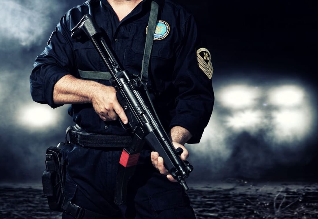 guard carrying weapon